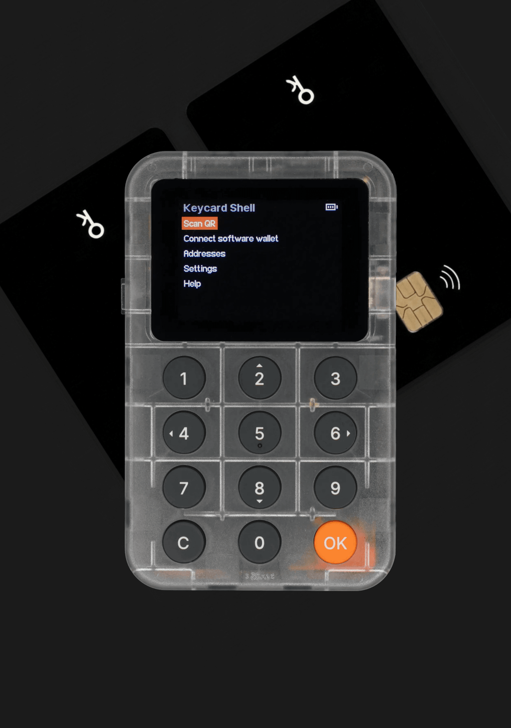 검은색 배경의 키패드와 화면이 있는 반투명 전자 기기